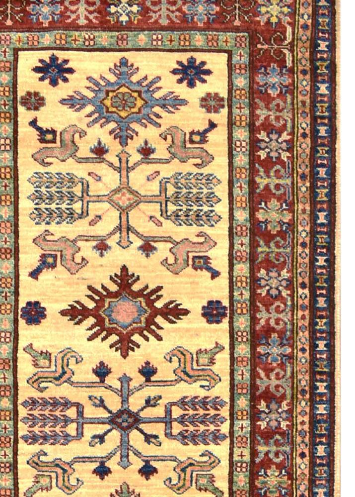 Handmade Afghan Super Kazakh runner rug featuring geometric tribal motifs on a cream background.