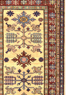 Handmade Afghan Super Kazakh runner rug featuring geometric tribal motifs on a cream background.