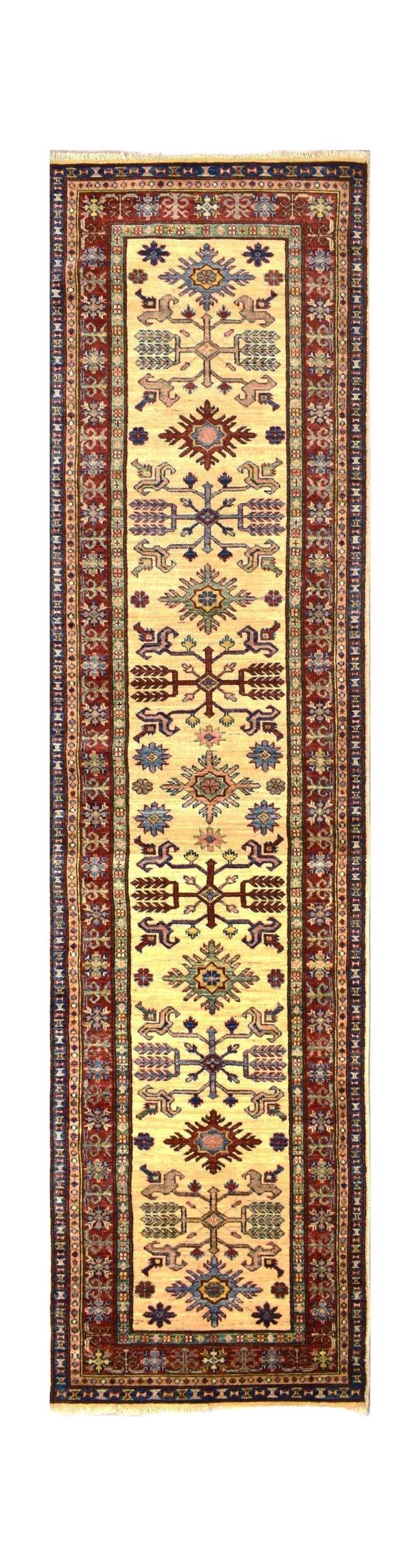Handmade Afghan Super Kazakh runner rug featuring geometric motifs on a cream field.