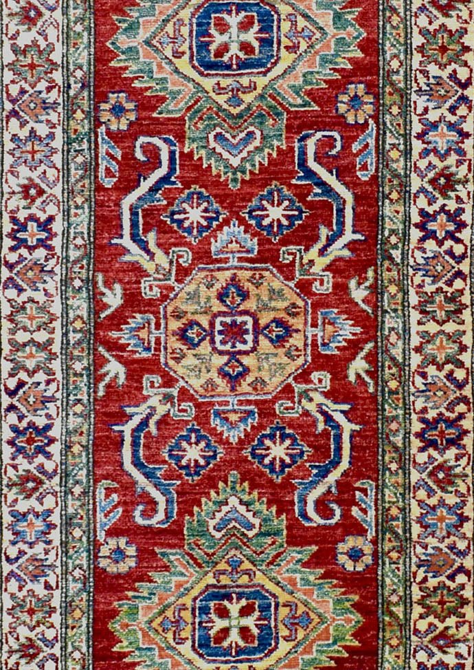 Handmade Afghan Super Kazakh runner rug featuring a geometric red field with blue and gold motifs.