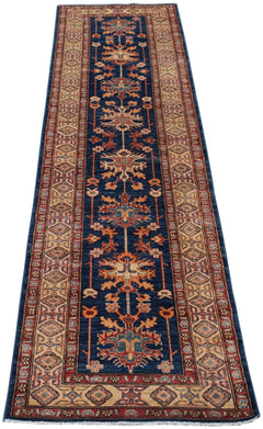 Handmade Afghan Super Kazakh runner rug featuring geometric floral motifs on a deep blue field.