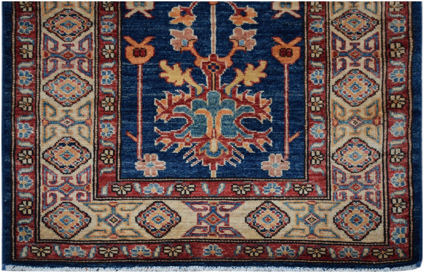 Handmade Afghan Super Kazakh runner rug featuring a blue field with traditional geometric motifs.