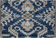 A handmade Afghan Super Kazakh runner featuring a traditional blue and cream geometric floral pattern.