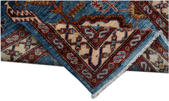A handmade Afghan Super Kazakh runner featuring traditional geometric motifs in blue and red.