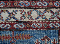 A close-up of an Afghan Super Kazakh runner featuring traditional geometric patterns in wool.