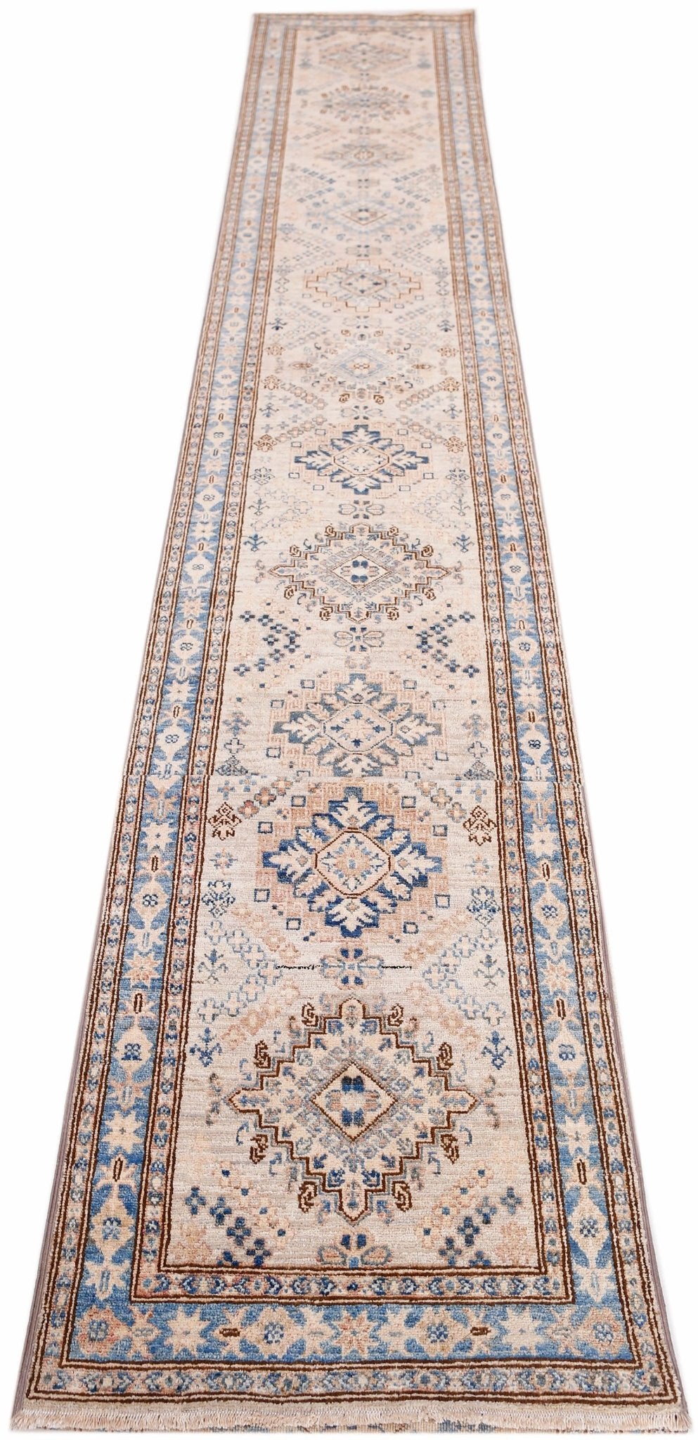 A long, handmade Afghan Super Kazakh runner featuring traditional blue and beige geometric motifs.