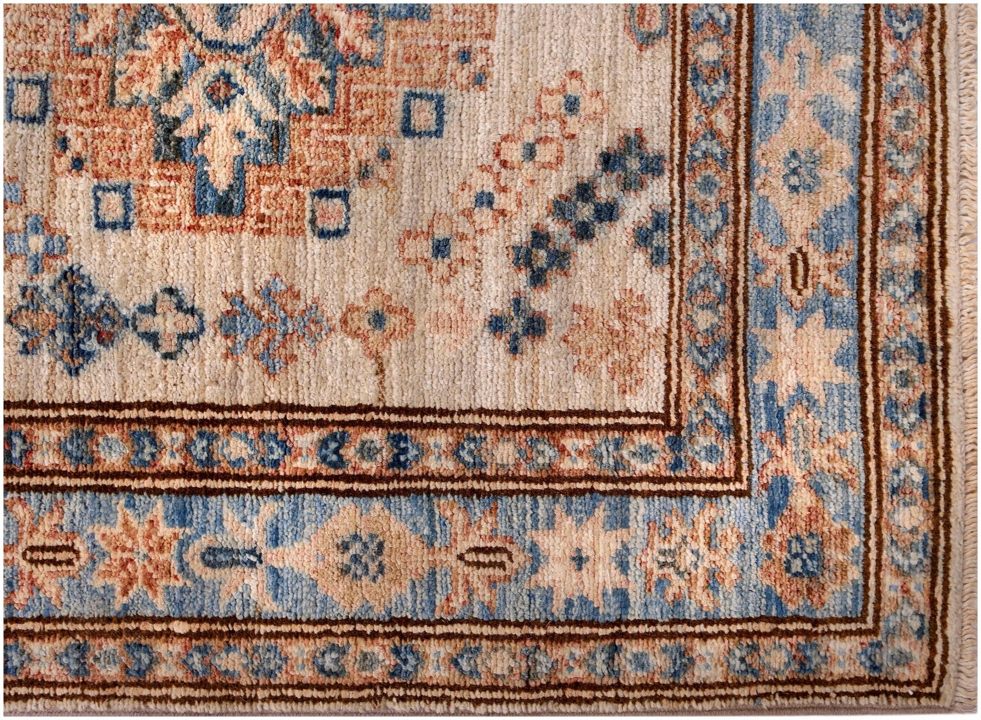 An Afghan Super Kazakh runner featuring traditional geometric motifs in blue, cream, and rust tones.