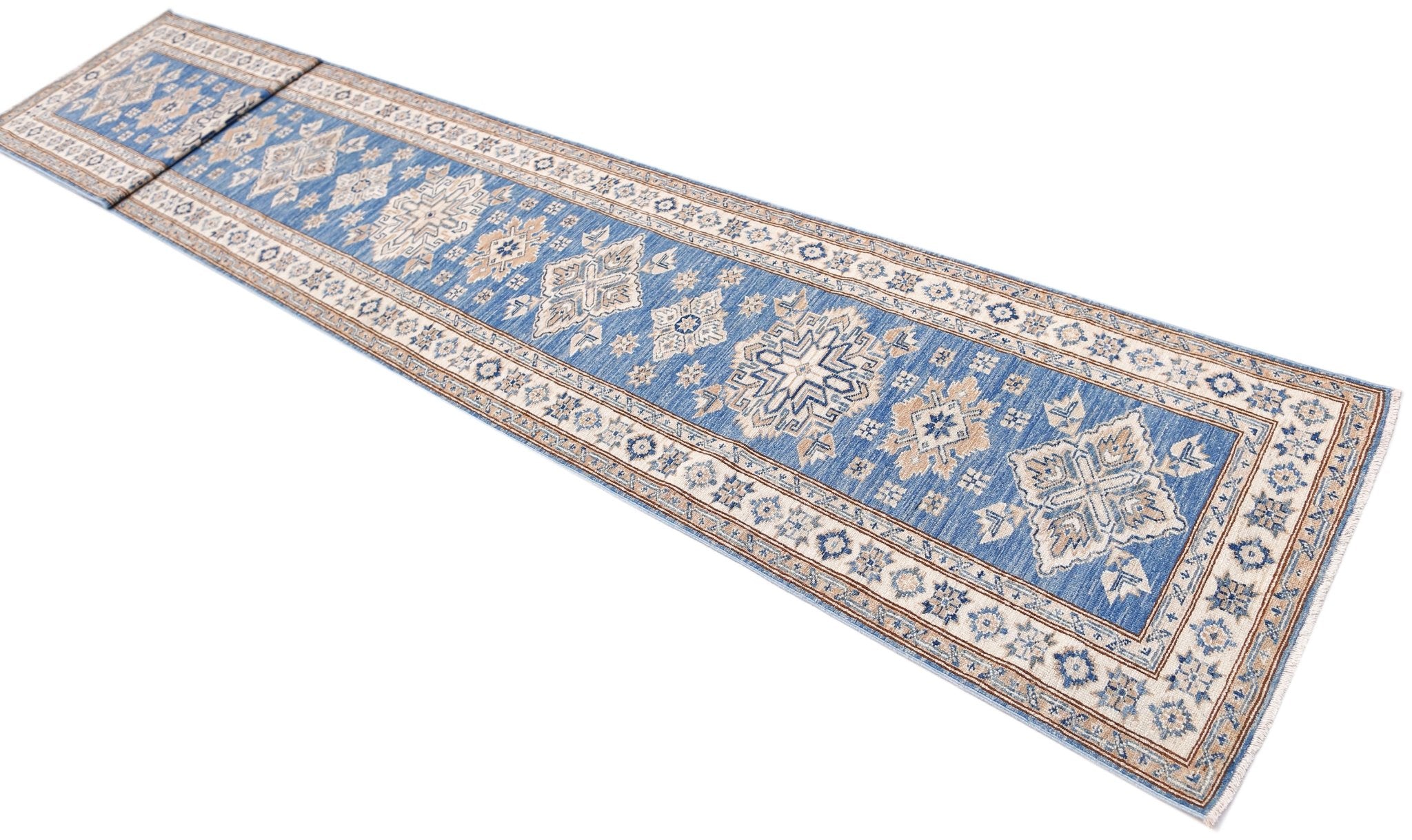 A long, handmade Afghan Super Kazakh runner rug featuring traditional geometric motifs in blue and tan.
