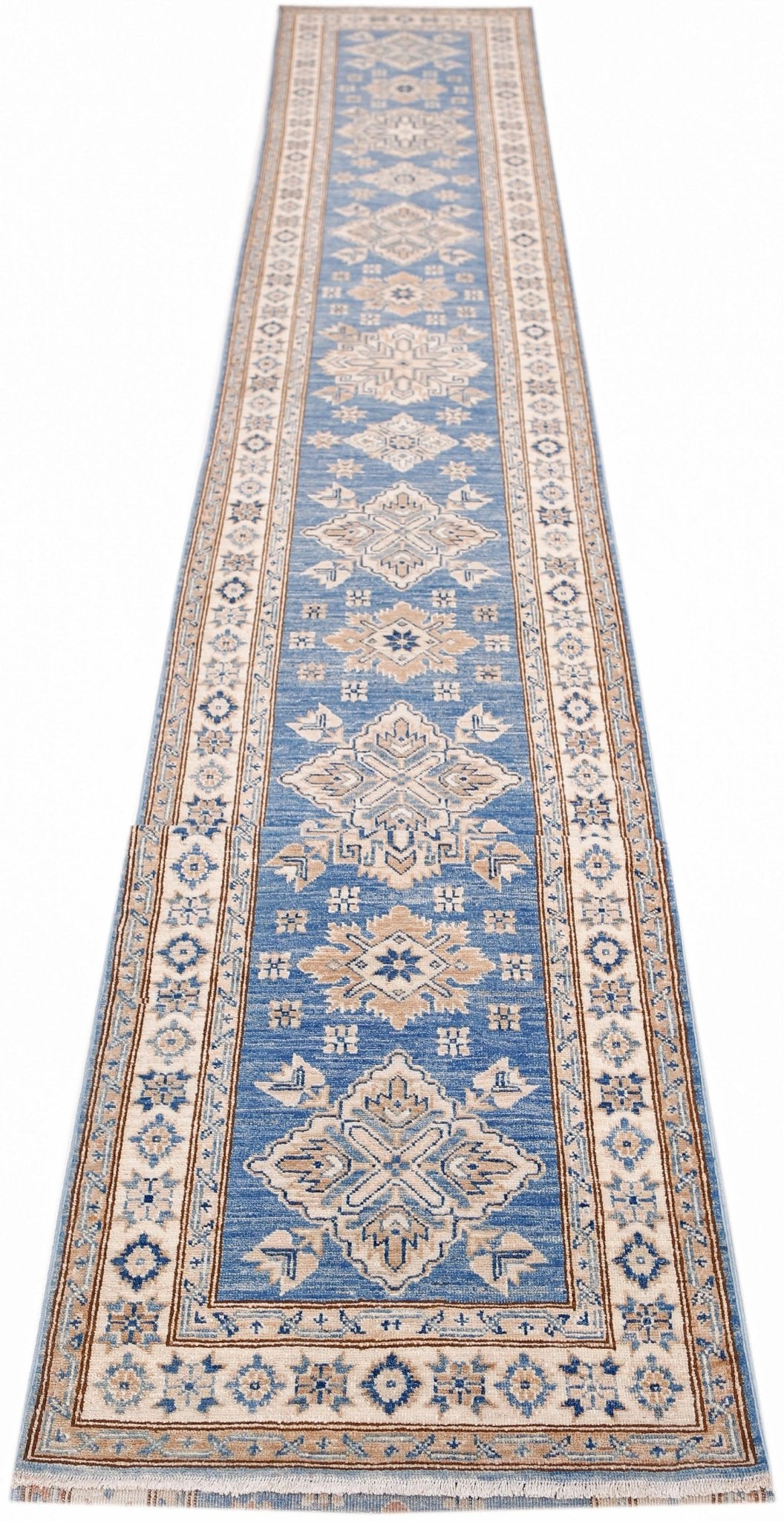 A long, handmade Afghan Super Kazakh runner rug featuring traditional geometric motifs in blue.