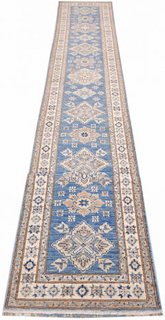 A long, handmade Afghan Super Kazakh runner rug featuring traditional geometric motifs in blue.