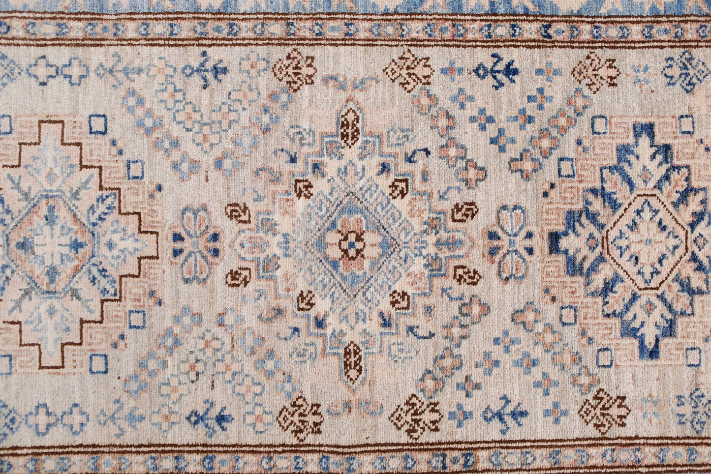Handmade Afghan Super Kazakh runner featuring traditional geometric motifs in blue and beige.