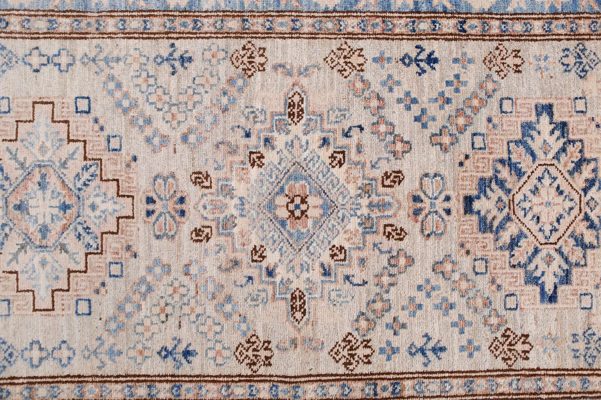 Handmade Afghan Super Kazakh runner featuring traditional geometric motifs in blue and beige.
