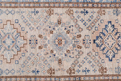 Handmade Afghan Super Kazakh runner featuring traditional geometric motifs in blue and beige.