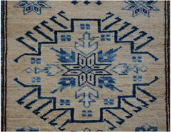 Handmade Afghan Super Kazakh runner rug featuring a traditional blue geometric medallion pattern.