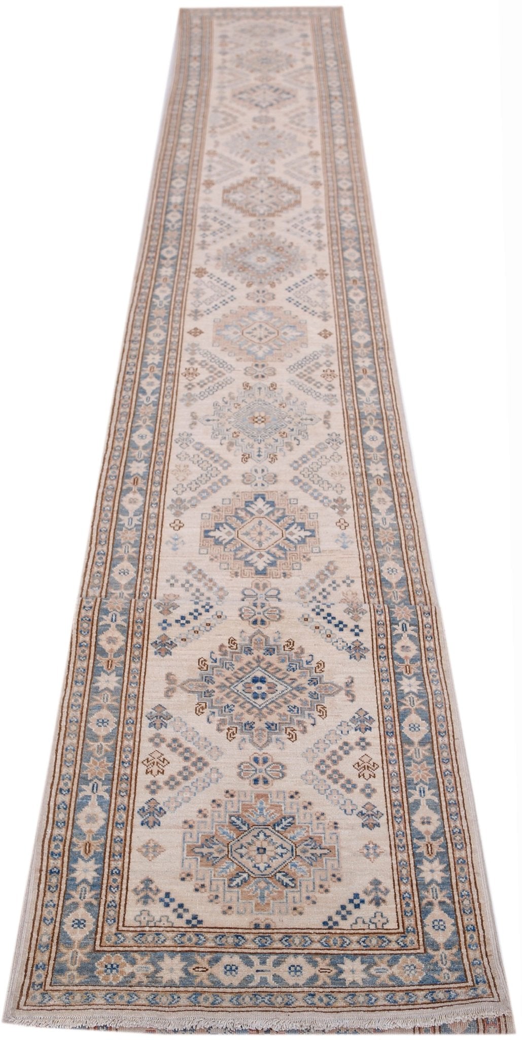 A long, handmade Afghan Super Kazakh runner rug featuring traditional geometric motifs in blue and tan.