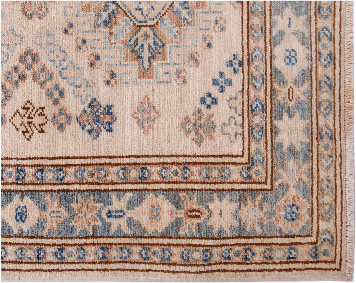 A handmade Afghan Super Kazakh runner featuring traditional geometric motifs in blue and tan wool.