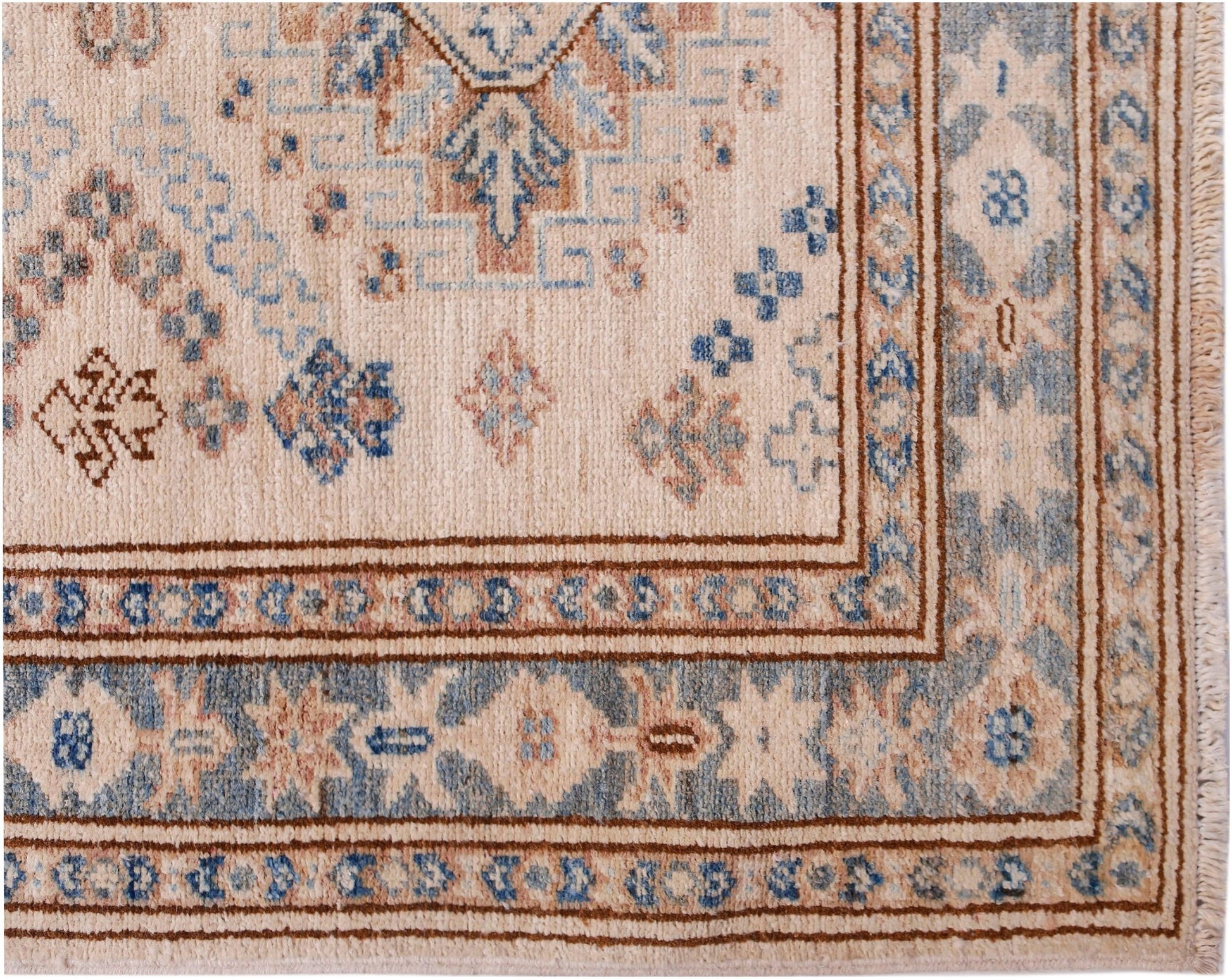 A handmade Afghan Super Kazakh runner featuring traditional geometric motifs in blue and tan wool.