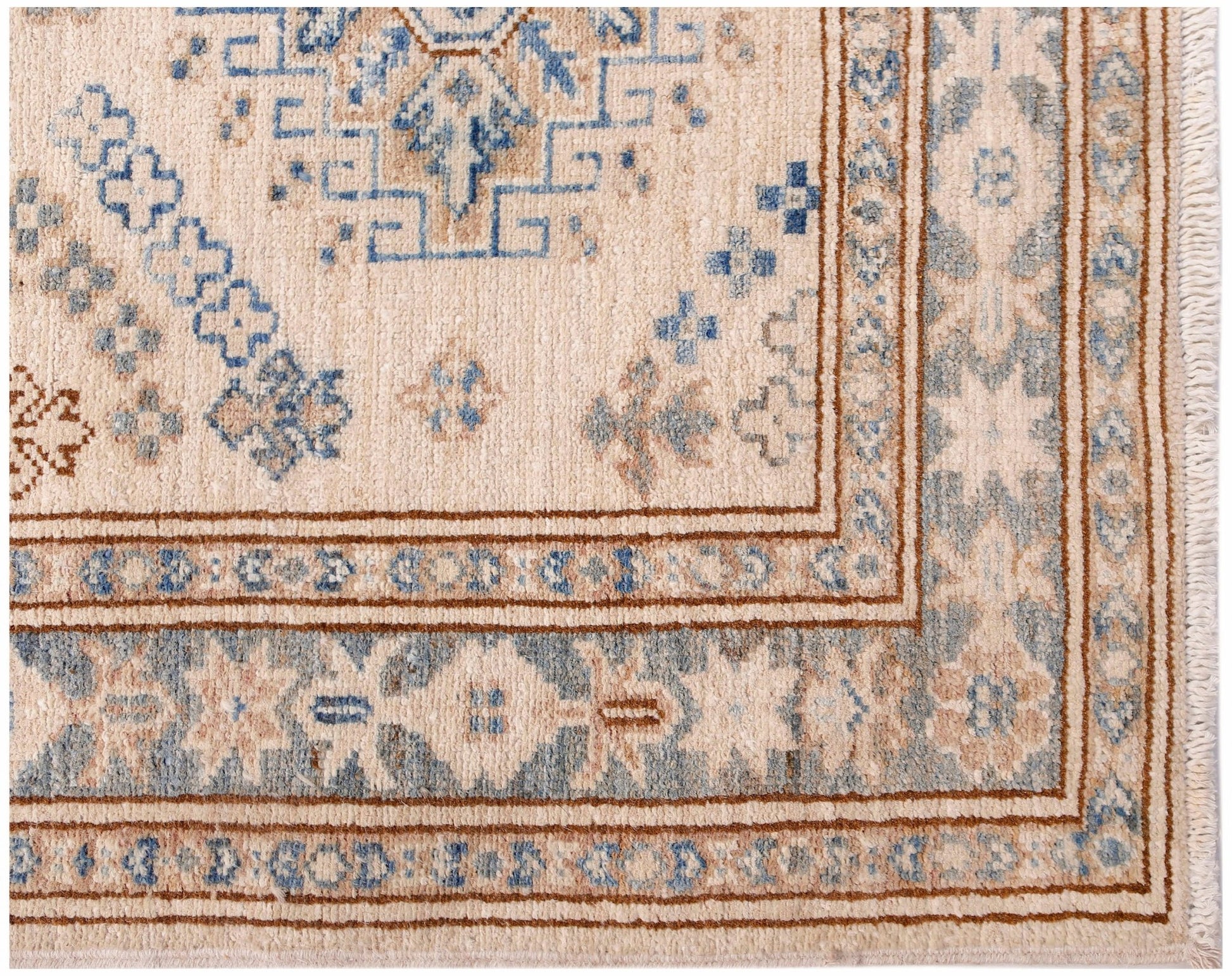 A handmade Afghan Super Kazakh runner featuring traditional blue and tan geometric motifs.