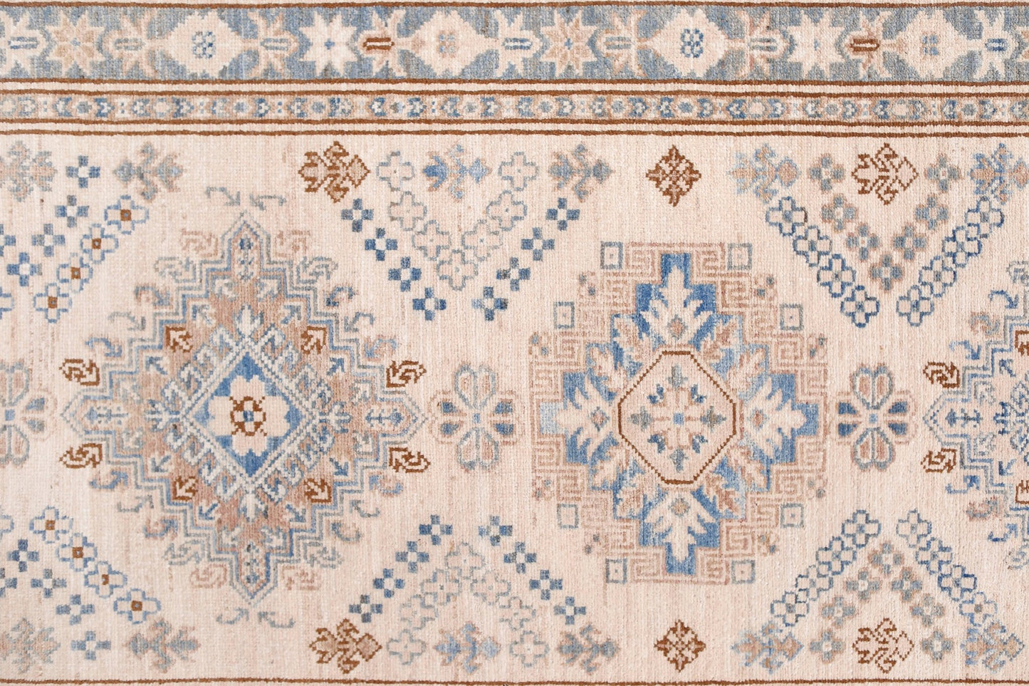 Handmade Afghan Super Kazakh runner featuring traditional geometric motifs in blue and tan.