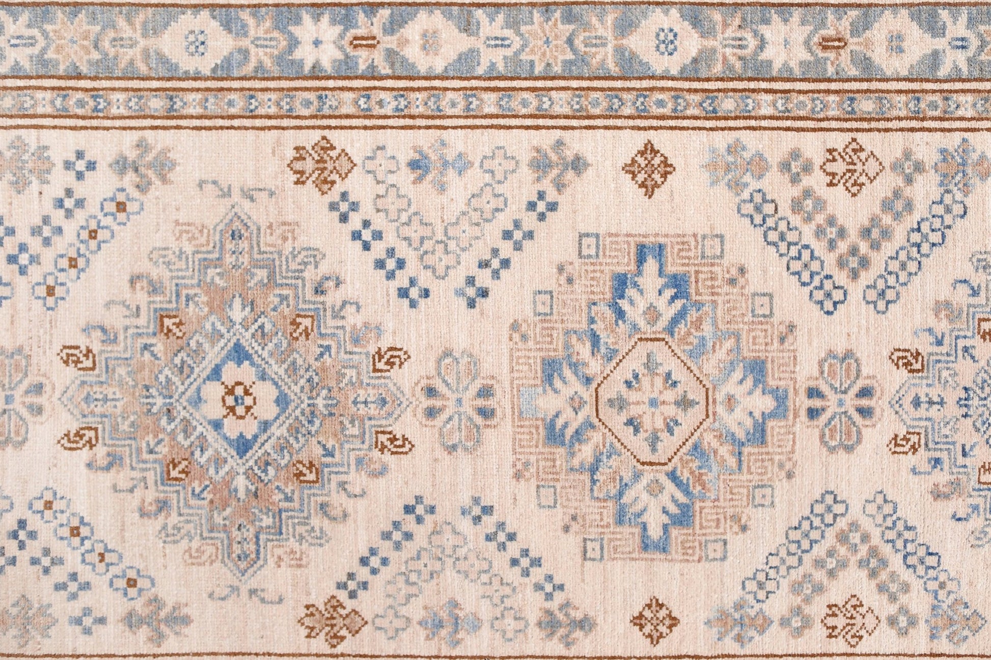 Handmade Afghan Super Kazakh runner featuring traditional geometric motifs in blue and tan.