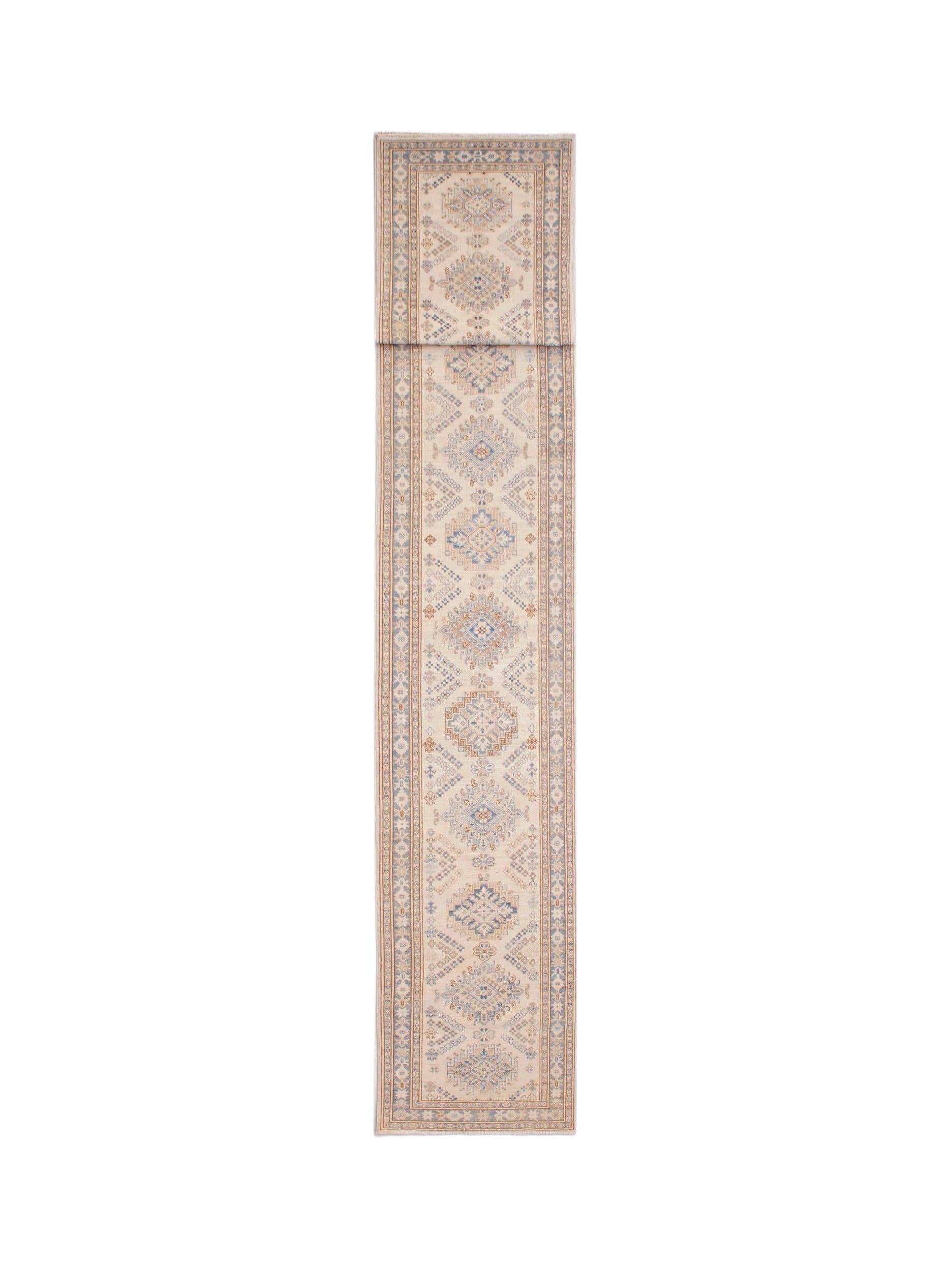 A long, handmade Afghan Super Kazakh runner featuring traditional geometric motifs in blue and tan.