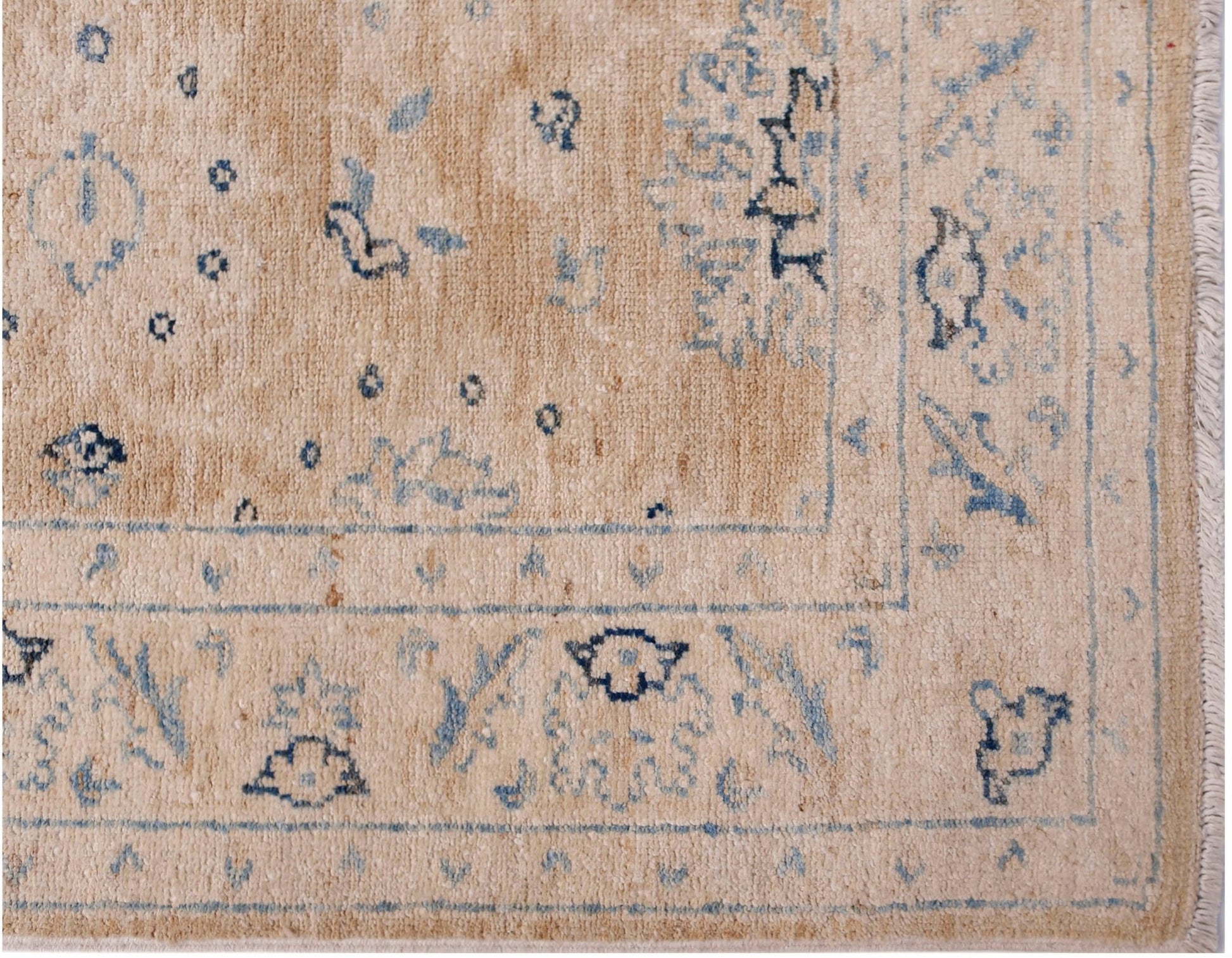 A handmade Afghan Super Kazakh runner featuring traditional blue motifs on a beige wool background.