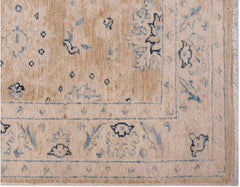 A handmade Afghan Super Kazakh runner featuring traditional blue motifs on a beige wool background.
