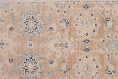 An Afghan Super Kazakh runner featuring traditional blue geometric motifs on a beige wool field.