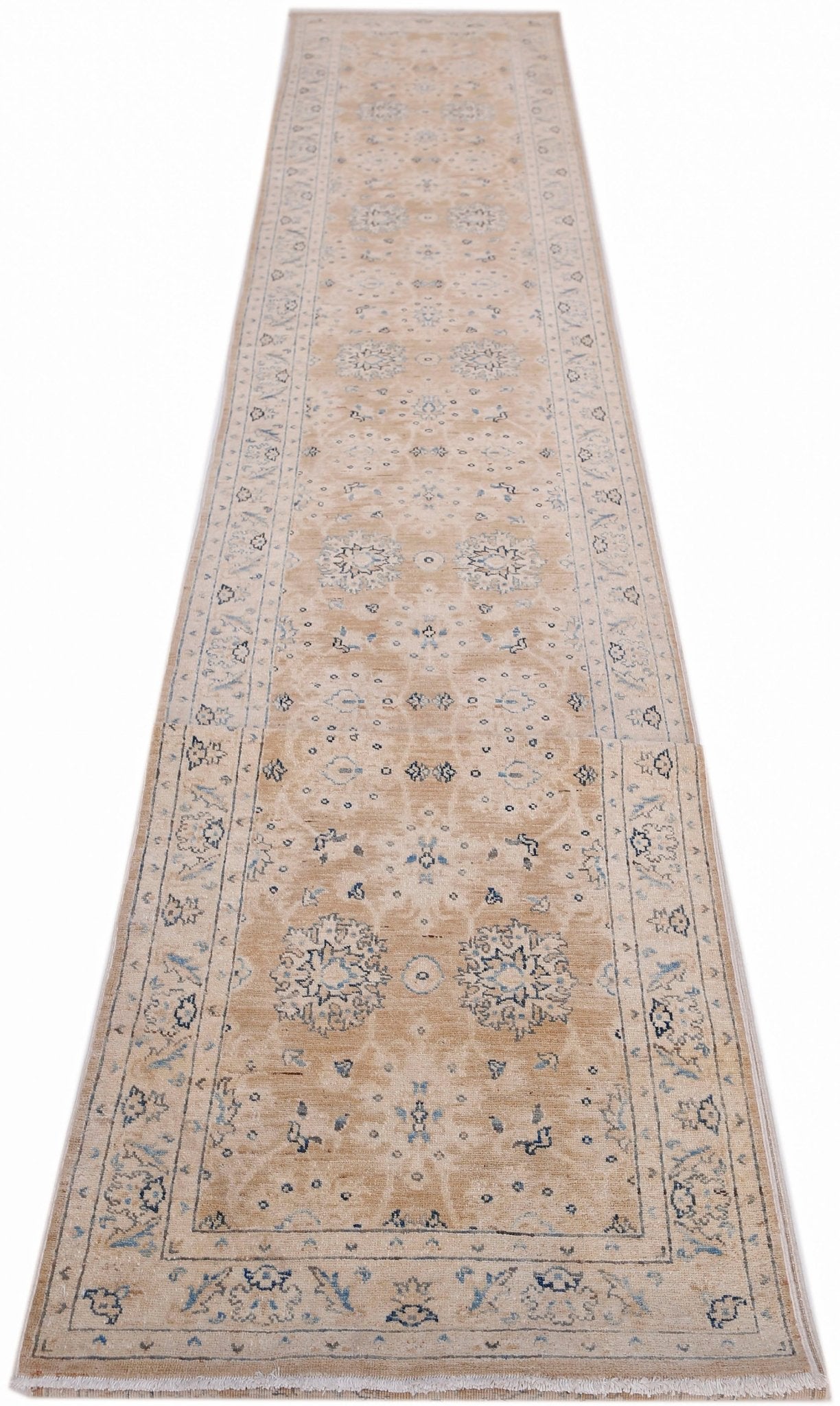 A long, handmade Afghan Super Kazakh runner rug featuring traditional blue and cream floral motifs.