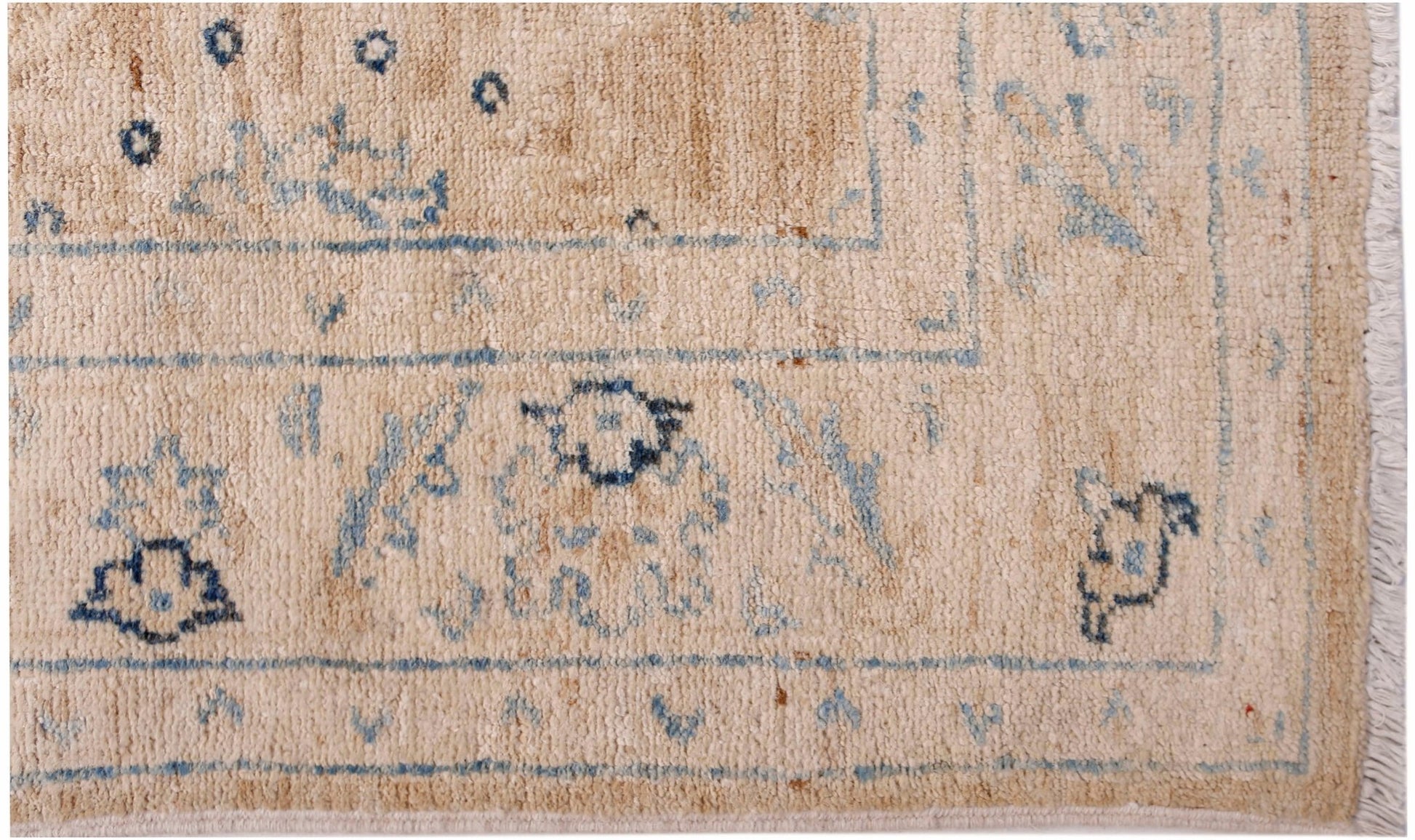 A hand-knotted Afghan Super Kazakh runner featuring traditional blue motifs on a beige wool field.
