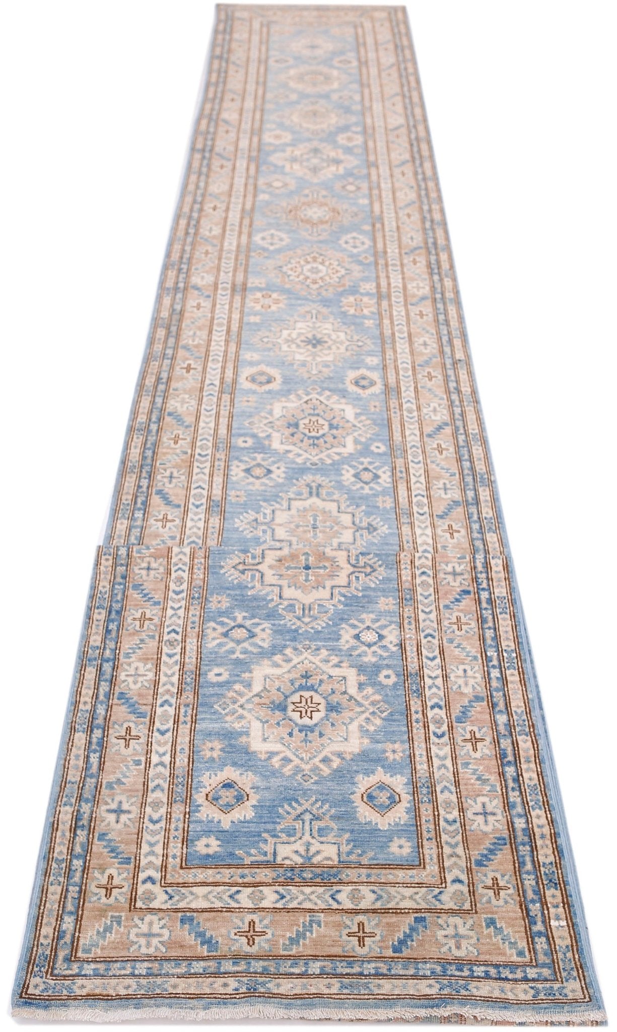 A long, handmade Afghan Super Kazakh runner rug featuring traditional geometric motifs in blue and tan.