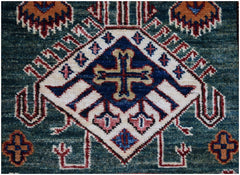 A handmade Afghan Super Kazakh runner featuring a central cross motif on a deep blue background.