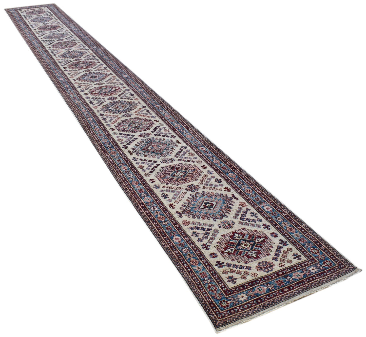 A long, handmade Afghan Super Kazakh runner rug featuring traditional geometric motifs in wool.