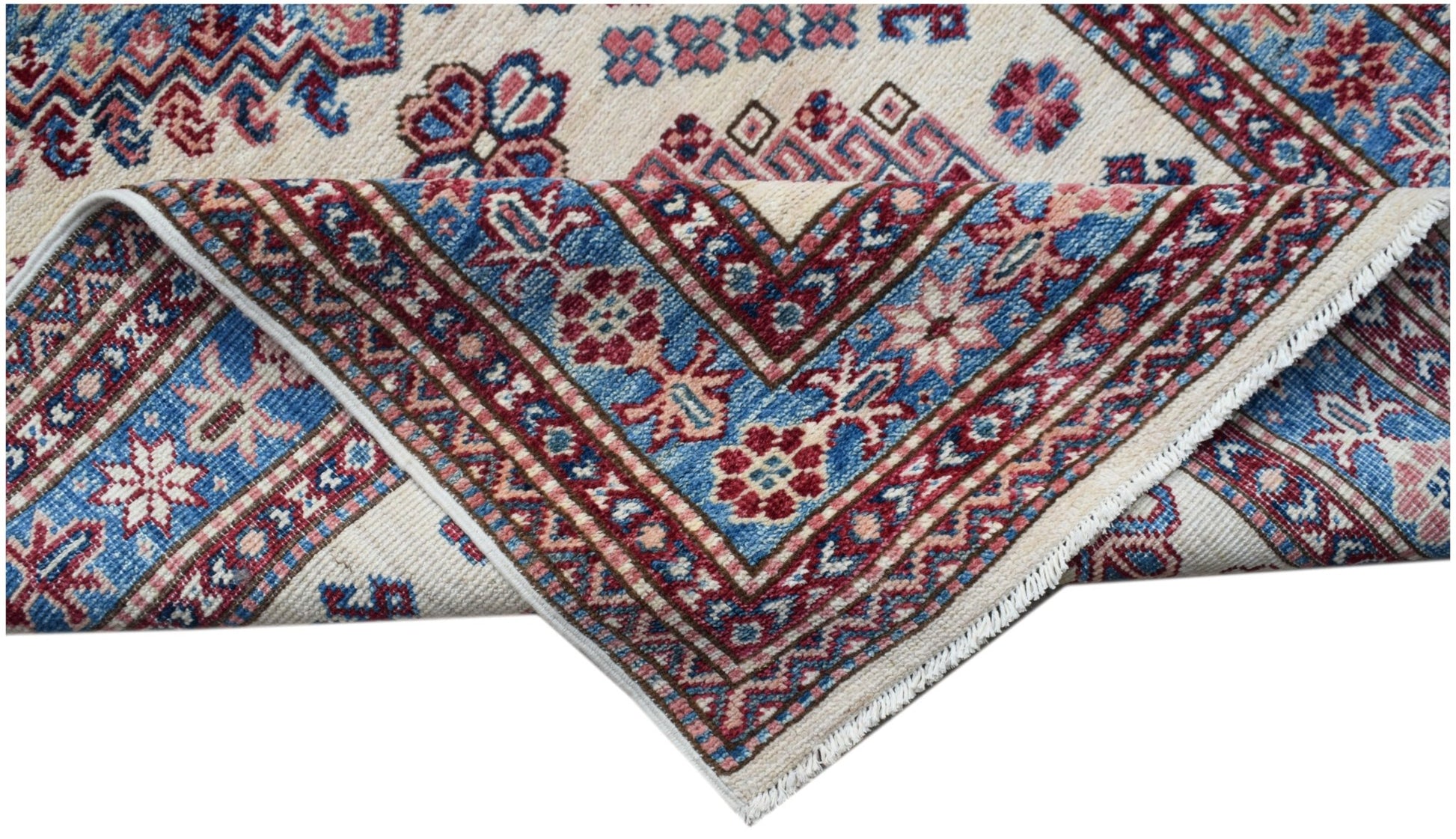 A handmade Afghan Super Kazakh runner featuring traditional geometric motifs in red and blue.