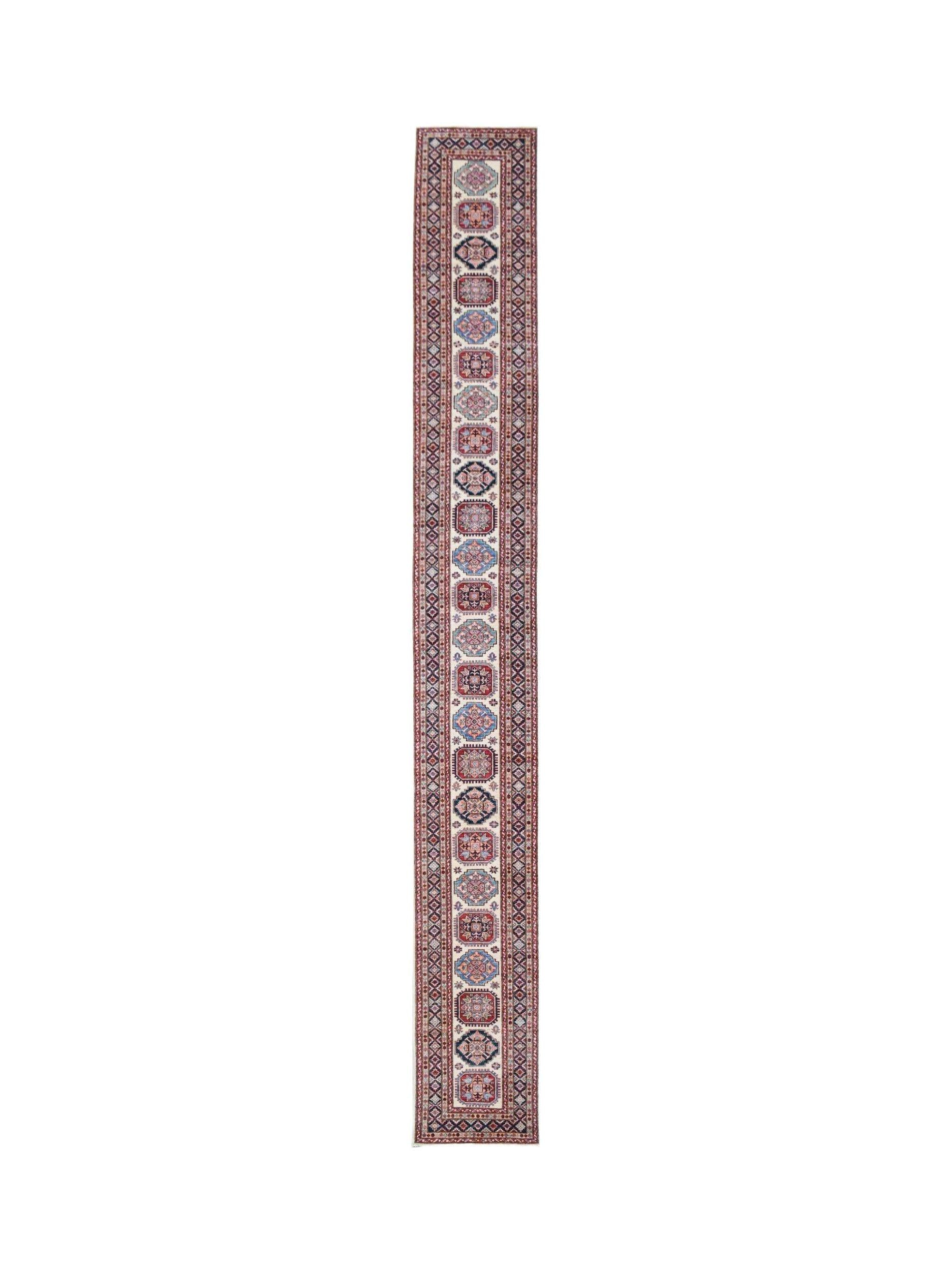 A long, handmade Afghan runner rug featuring repeating geometric medallions in red and blue tones.