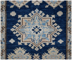 An Afghan Super Kazakh runner rug featuring a geometric star medallion in blue and beige tones.