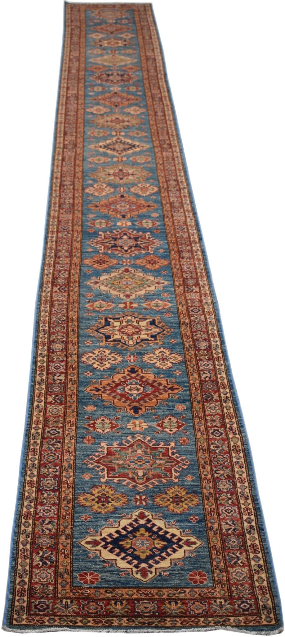 A long, handmade Afghan Super Kazakh runner rug featuring traditional geometric patterns in blue.