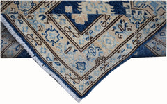 A handmade Afghan Super Kazakh runner featuring a geometric pattern in blue, beige, and grey.