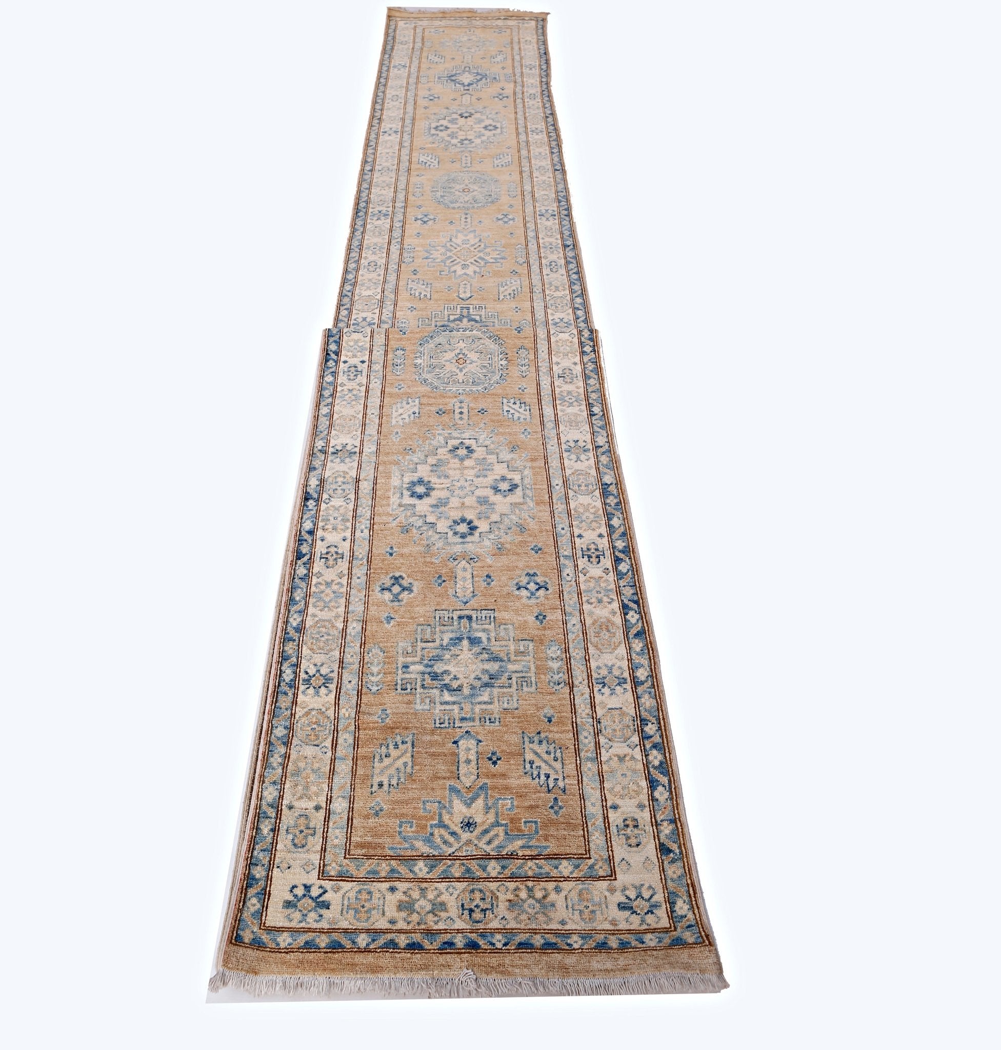 A long, handmade Afghan Super Kazakh runner featuring traditional blue geometric motifs on tan wool.