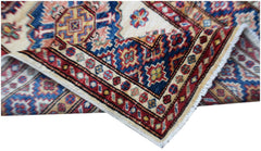 An Afghan Super Kazakh runner featuring traditional geometric motifs in red, blue, and cream.