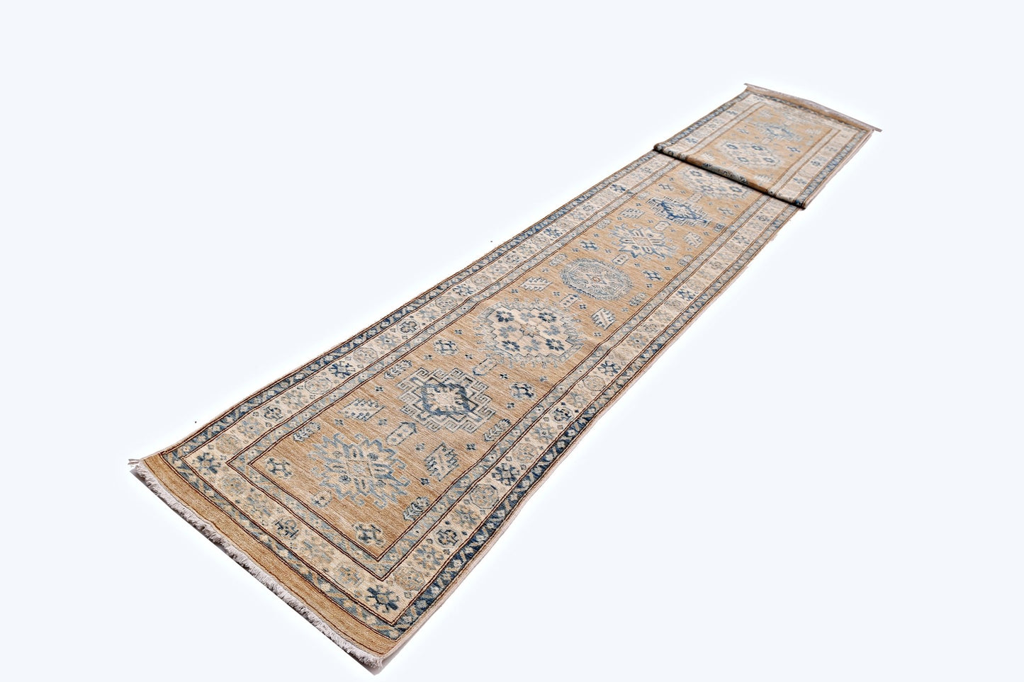 A long, handmade Afghan Super Kazakh runner rug featuring traditional blue motifs on a tan field.
