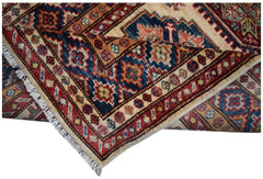 An Afghan Super Kazakh runner featuring traditional geometric motifs in red, blue, and cream wool.