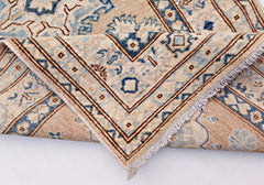 A handmade Afghan Super Kazakh runner featuring traditional blue and brown geometric motifs.