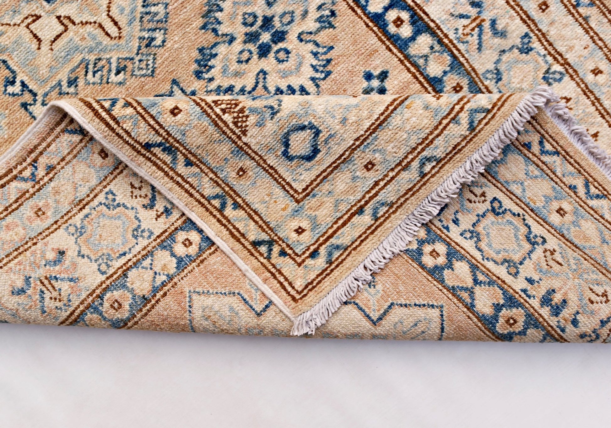 A hand-knotted Afghan Super Kazakh runner featuring traditional blue and beige geometric patterns.
