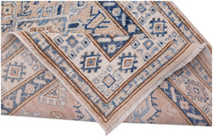 A handmade Afghan Super Kazakh runner featuring traditional blue and tan geometric patterns.