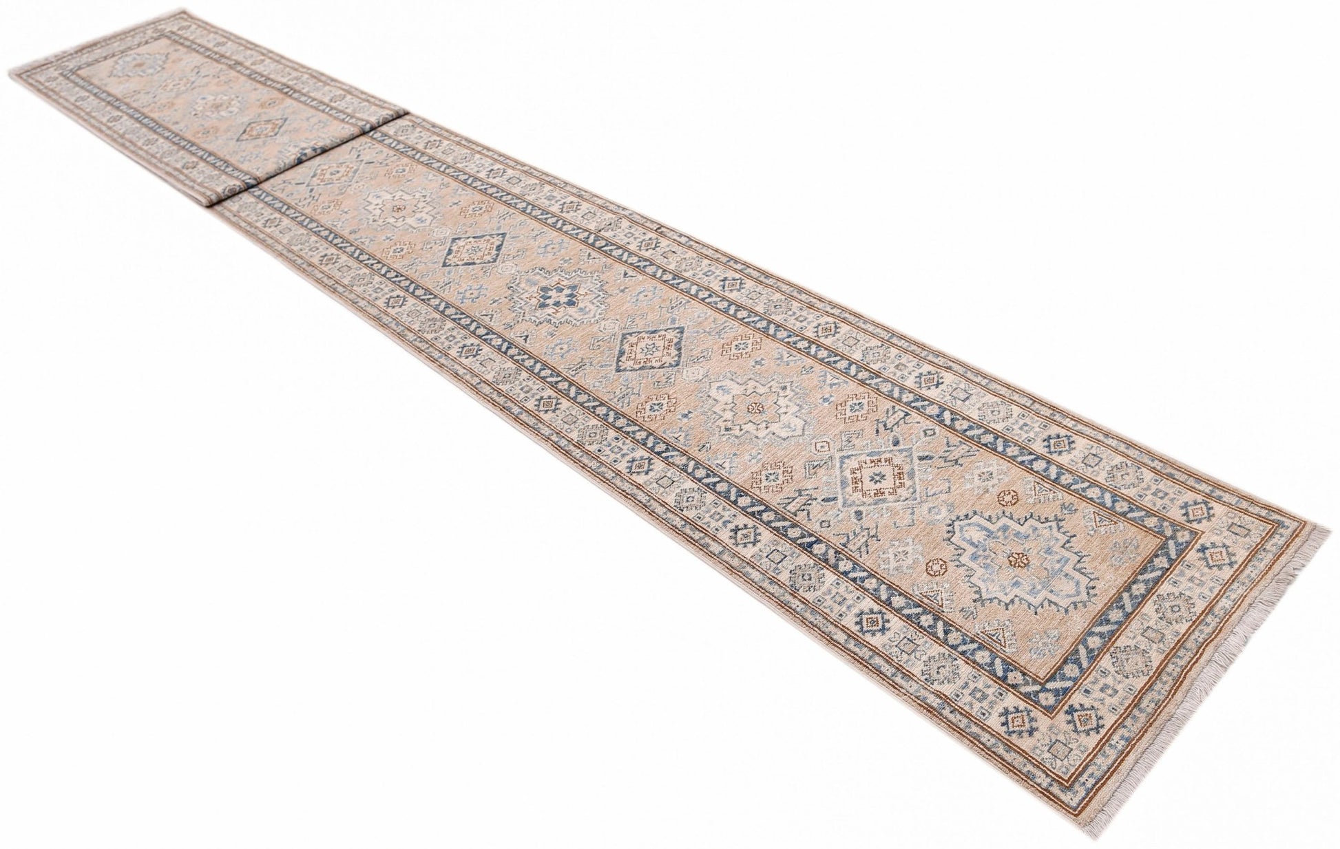 A long, handmade Afghan Super Kazakh runner rug featuring traditional geometric motifs in blue and tan.