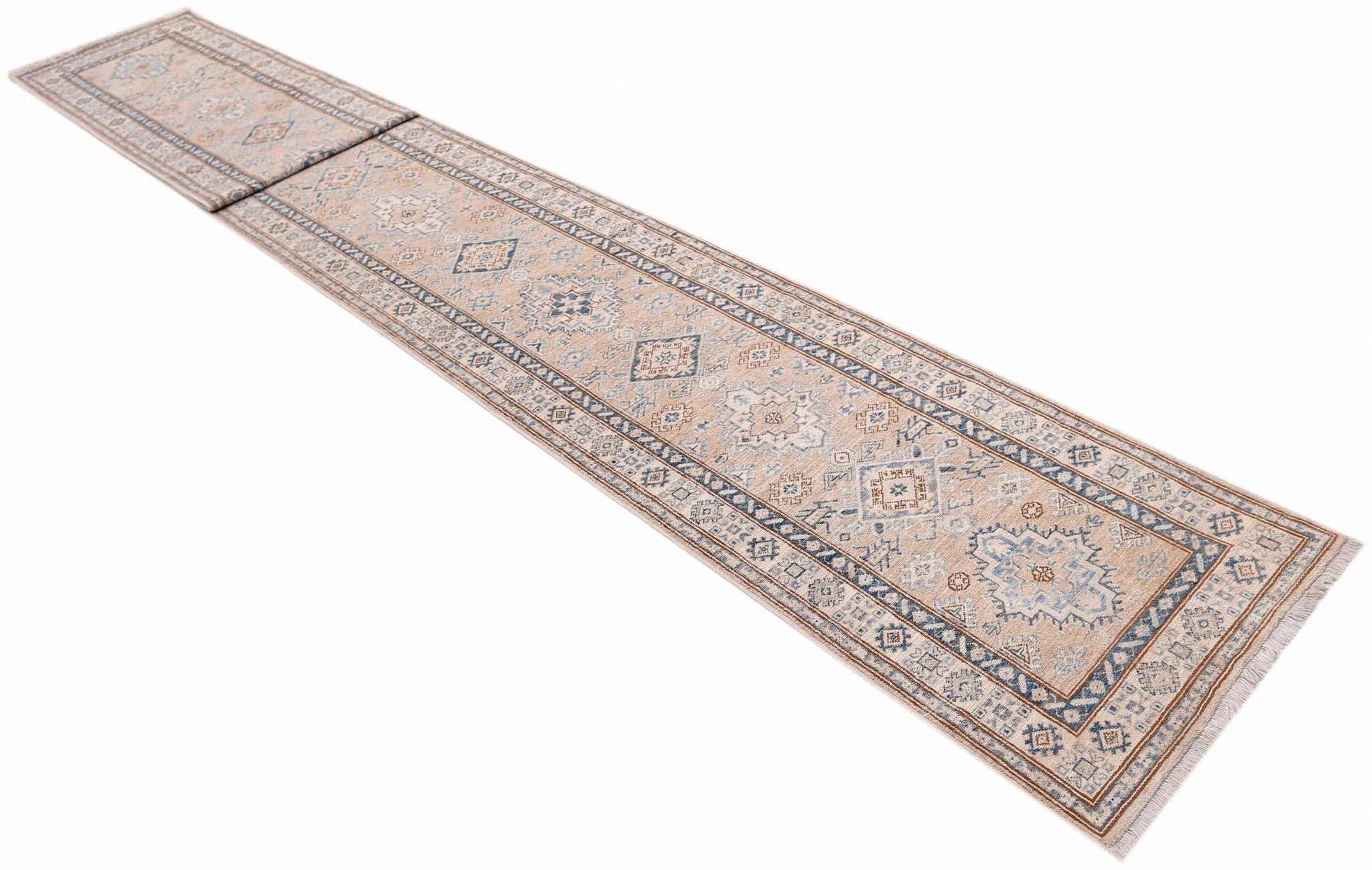 A long, handmade Afghan Super Kazakh runner rug featuring traditional geometric motifs in blue and tan.