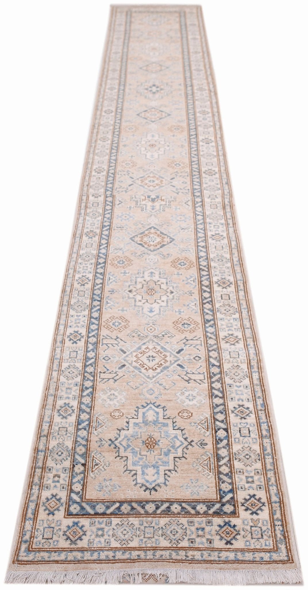 A long, handmade Afghan Super Kazakh runner rug featuring traditional geometric motifs in blue and tan.