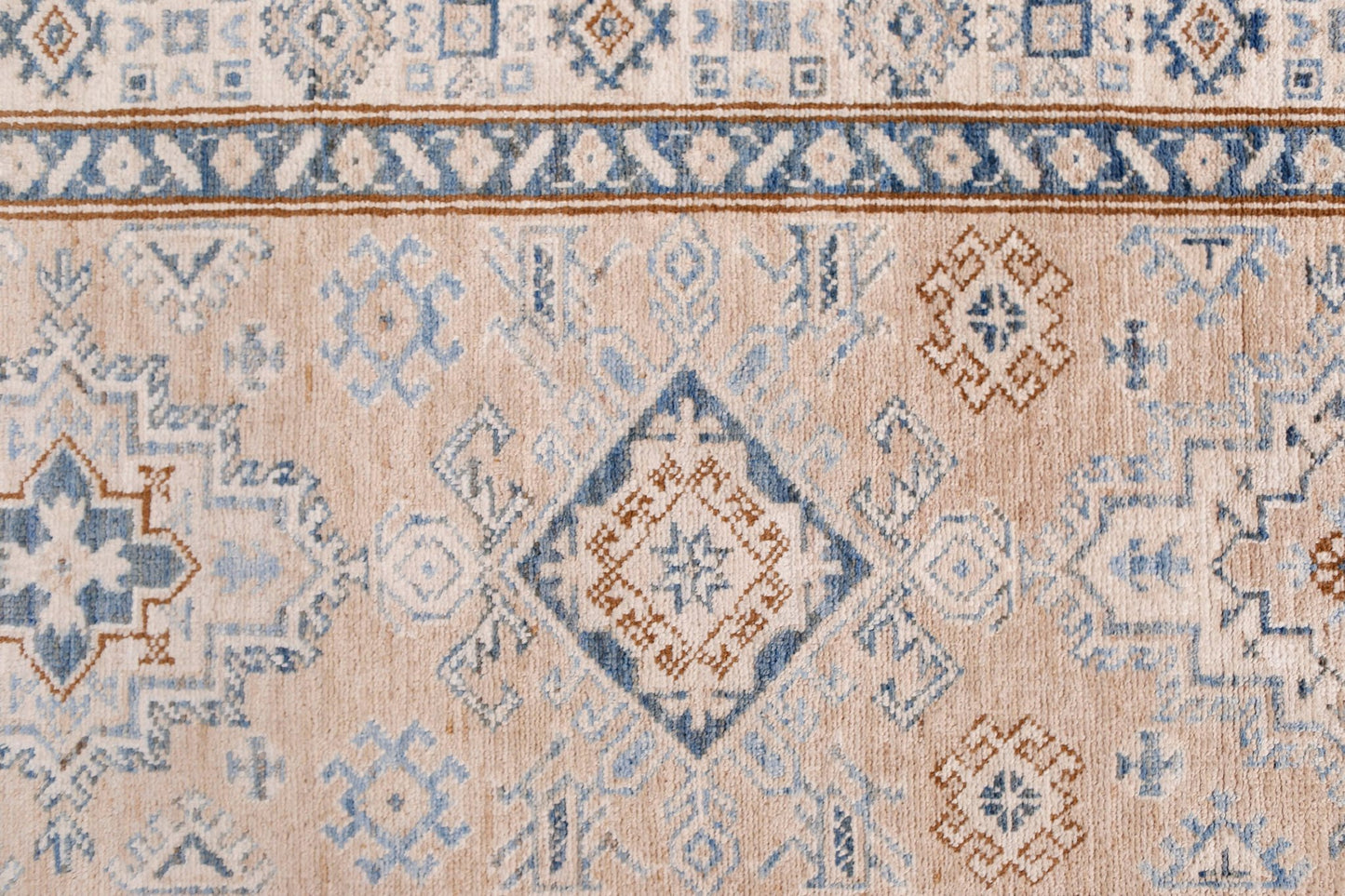 Handmade Afghan Super Kazakh runner featuring traditional blue and brown geometric motifs.
