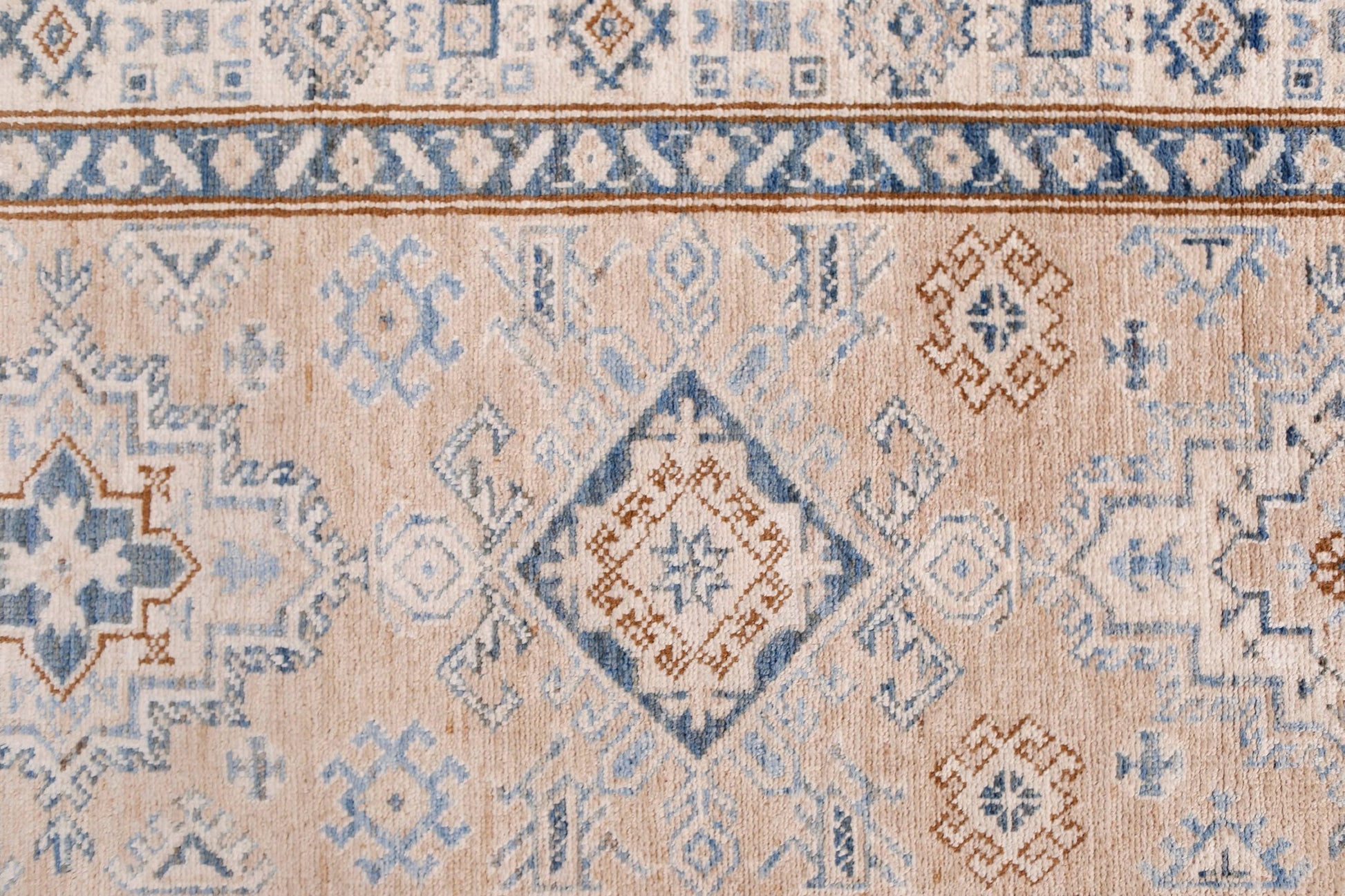 Handmade Afghan Super Kazakh runner featuring traditional blue and brown geometric motifs.